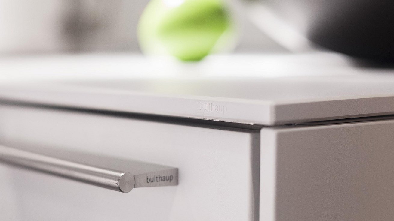 Detail of bulthaup stainless steel drawer pull.