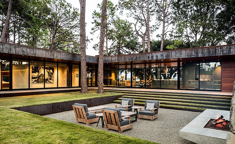 Exterior courtyard with outdoor furniture and fireplace
